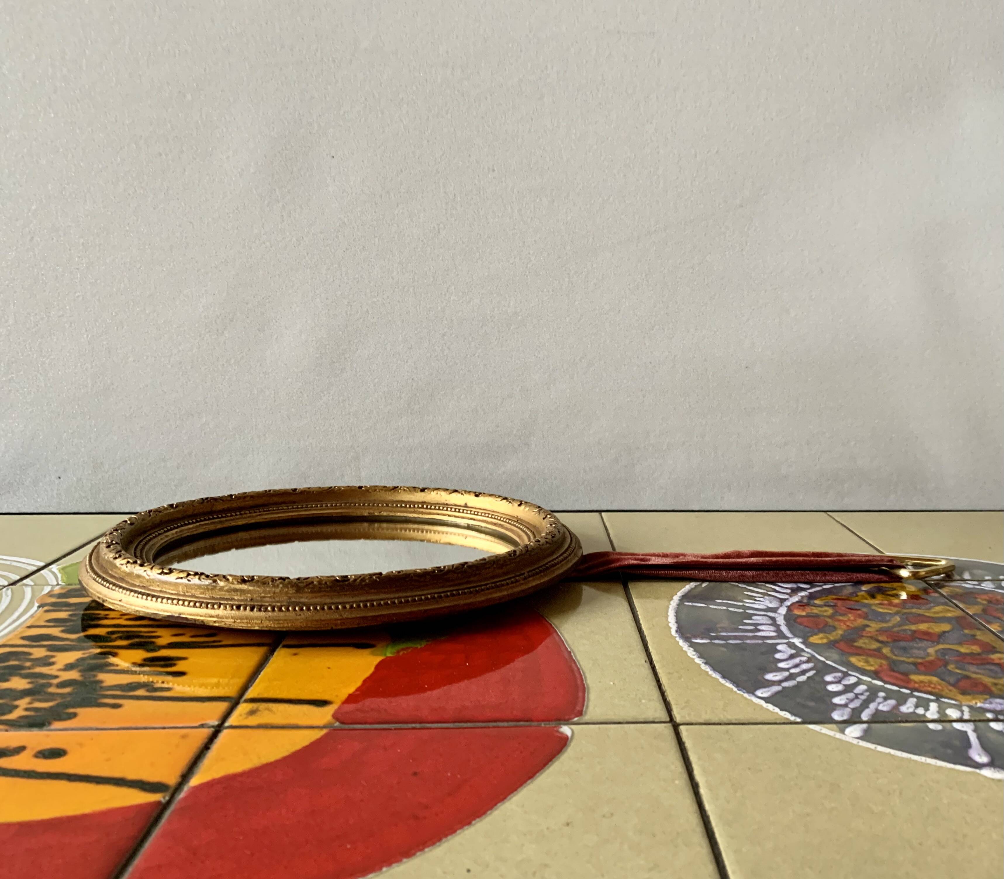 Small vintage wall mirror in gold painted wood