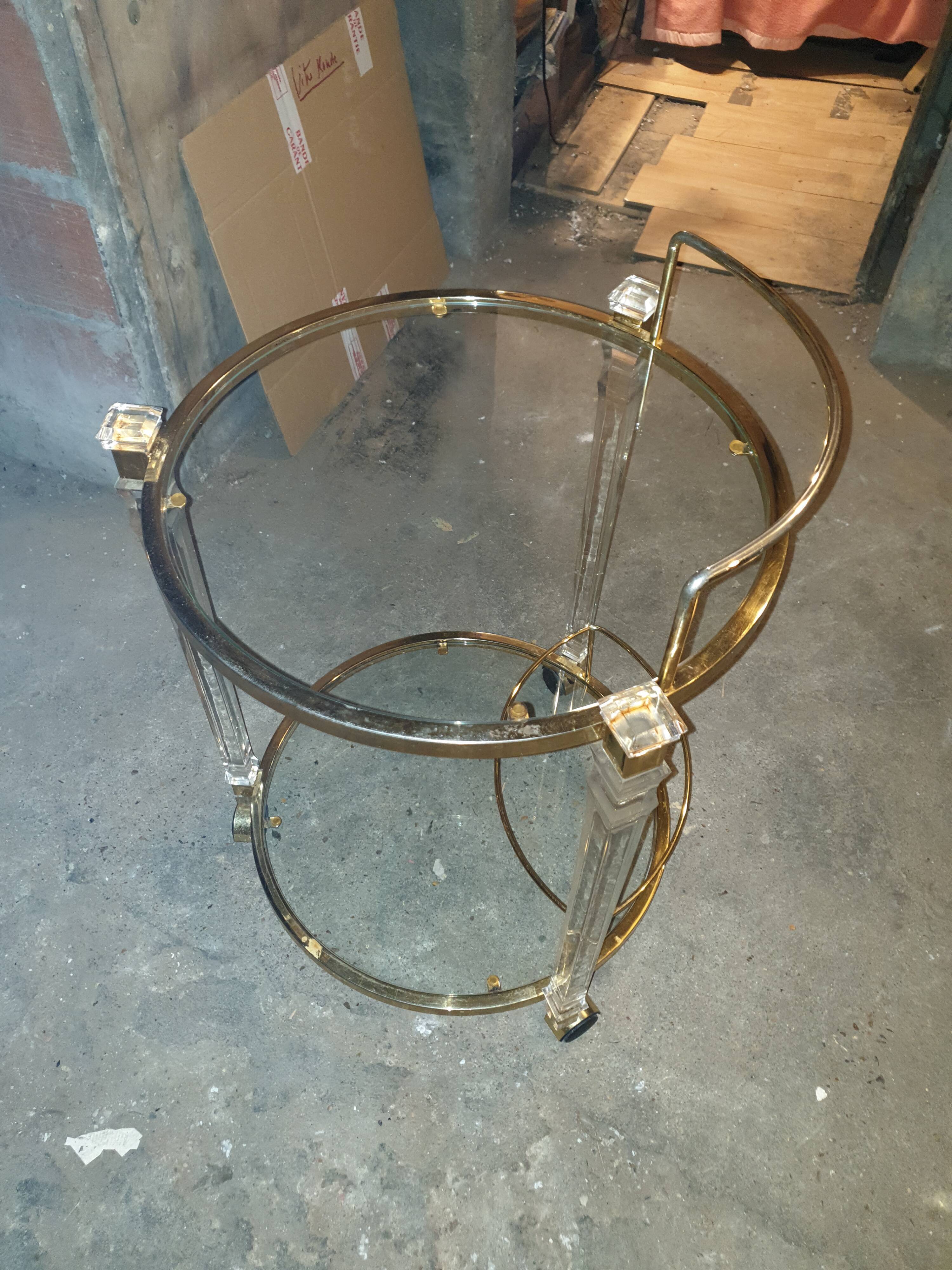 Round table in glass and brass and acrylic columns, 1980
