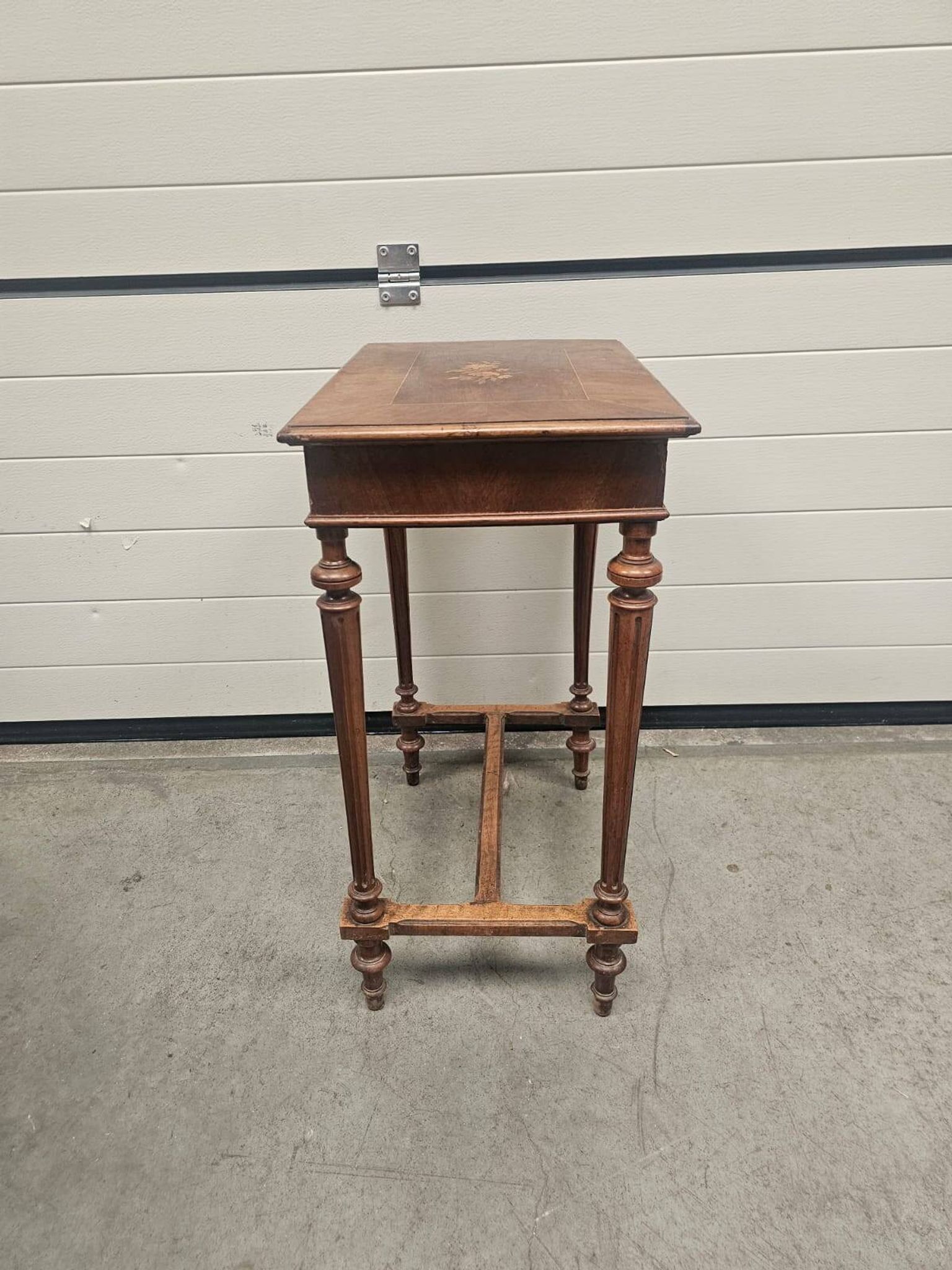 Antique dressing table with floral marquetry and integrated mirror.