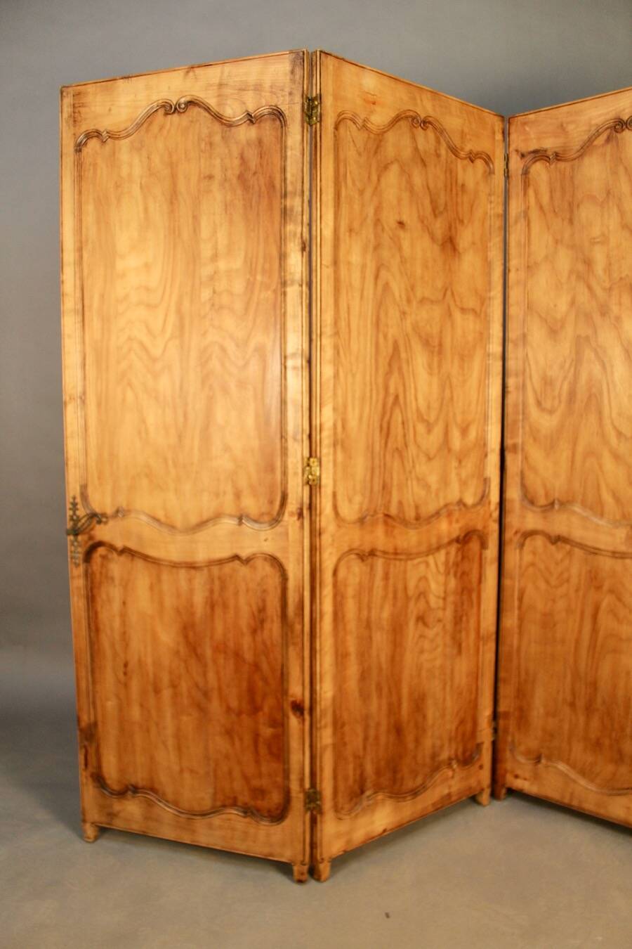 Large cherry wood folding screen with four double-sided panels.