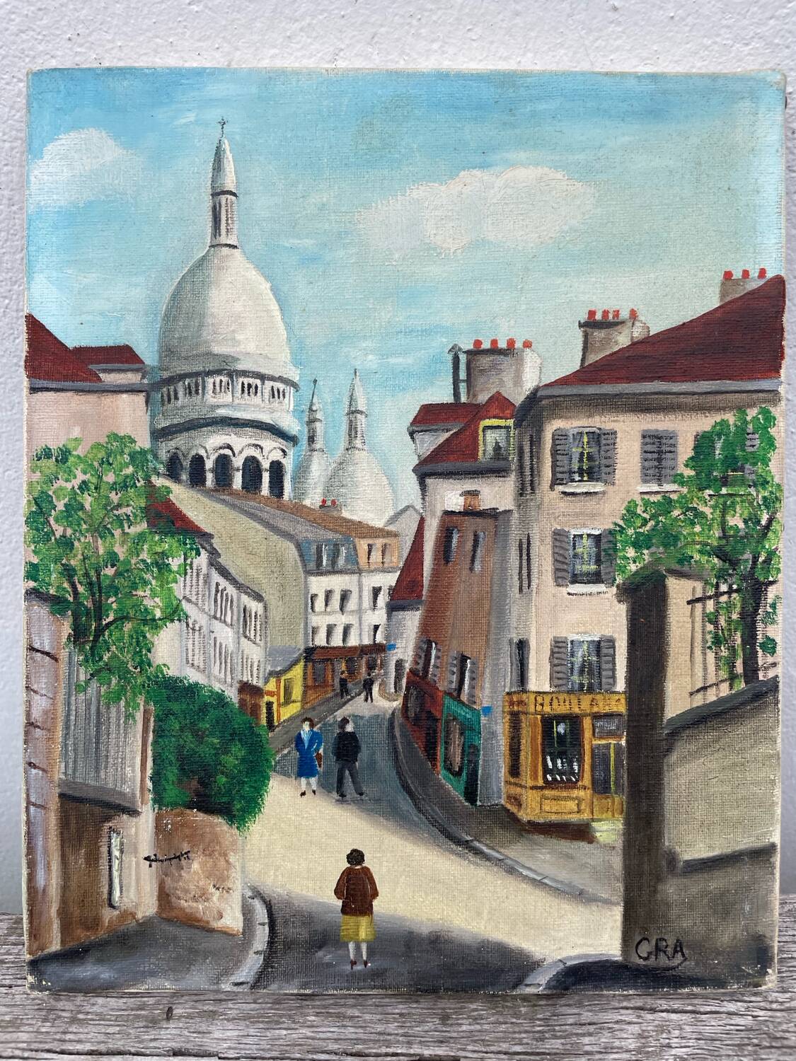 Old oil painting depicting a street in Montmartre
