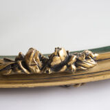 Golden oval mirror
