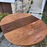 Extendable round dining table and 4 Baumann chairs.