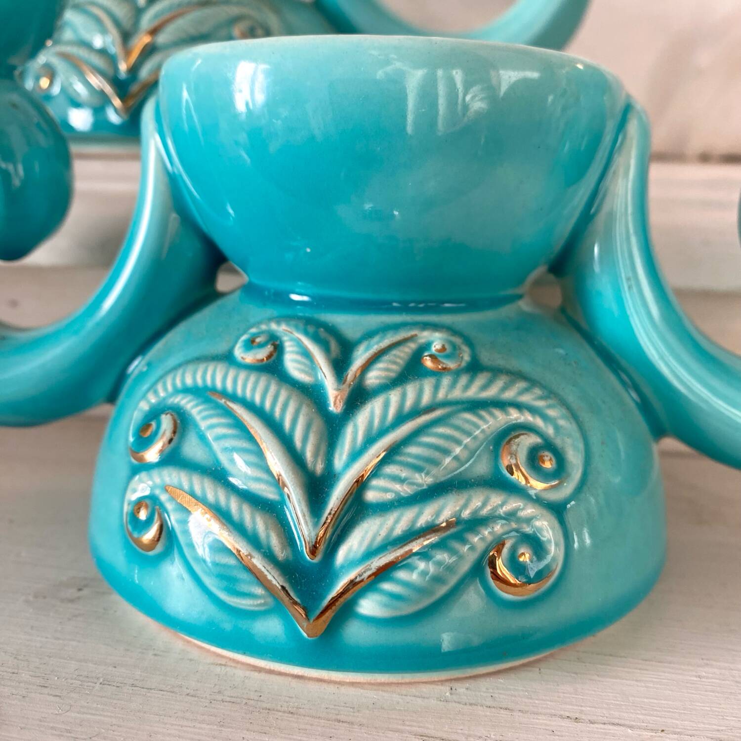 Pair of turquoise and gold double candlesticks