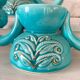 Pair of turquoise and gold double candlesticks