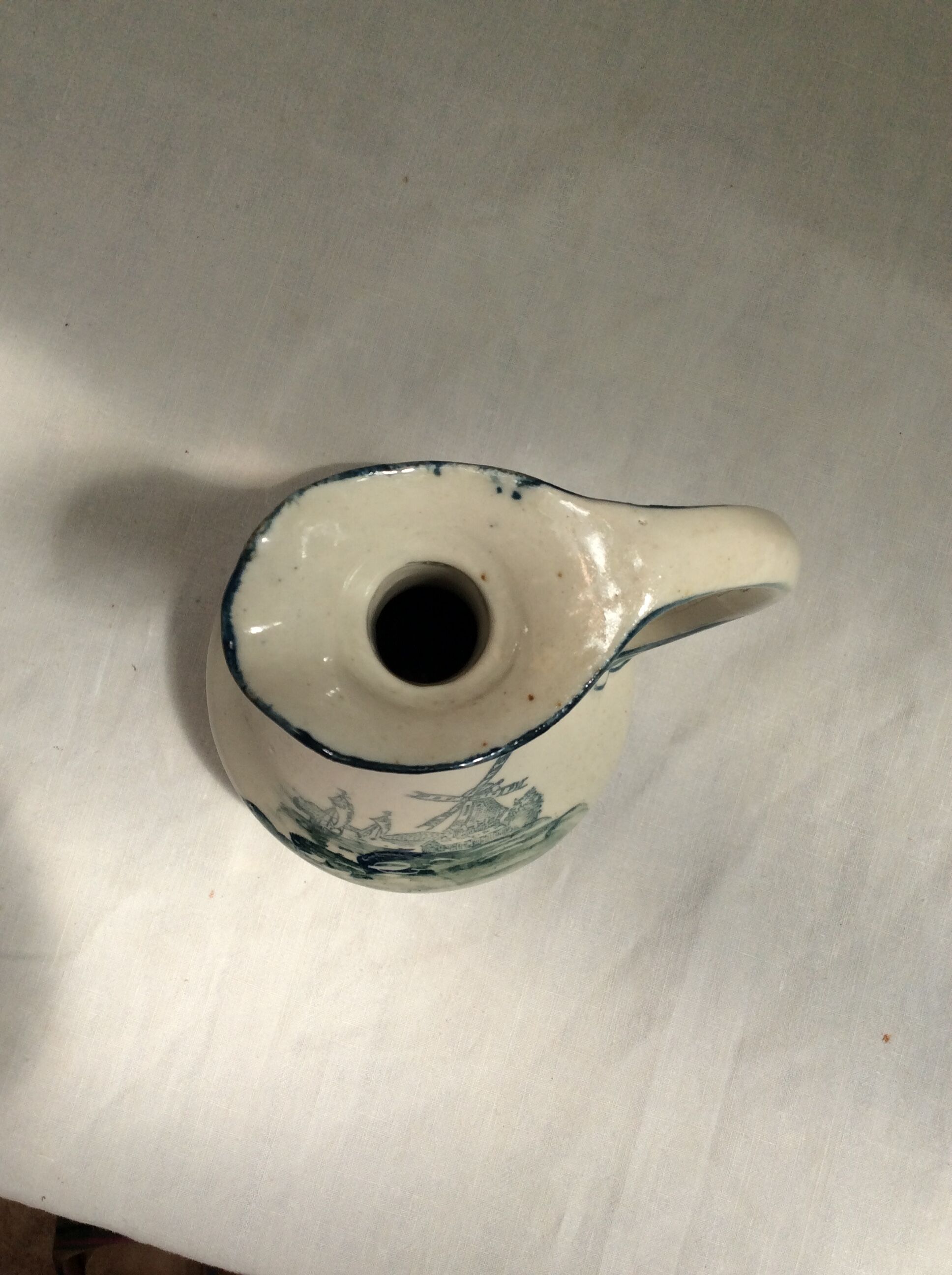 Old pitcher in Dutch-made earthenware signed