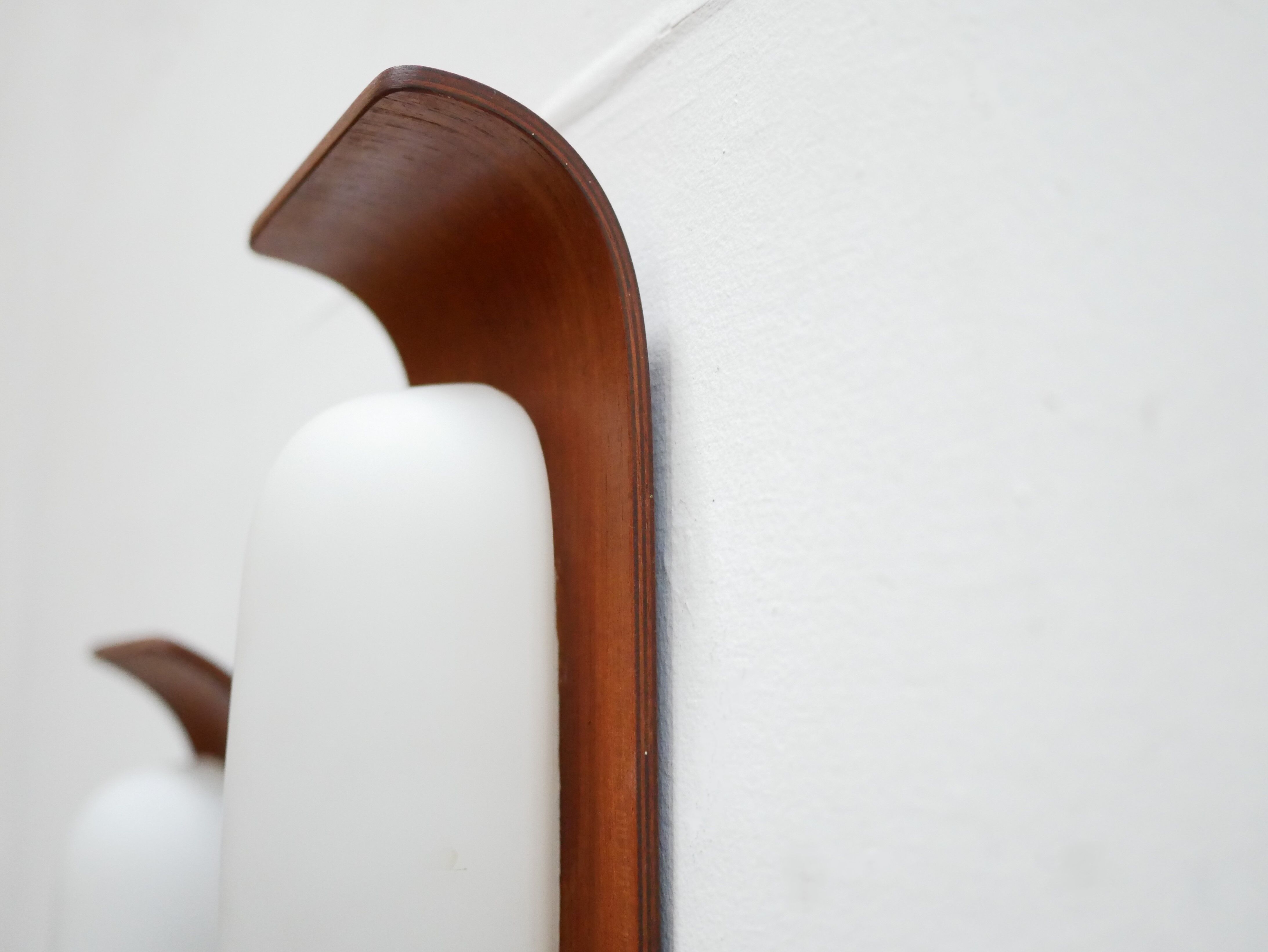 Pair of teak and opaline wall lamps by Goffredo Reggiani