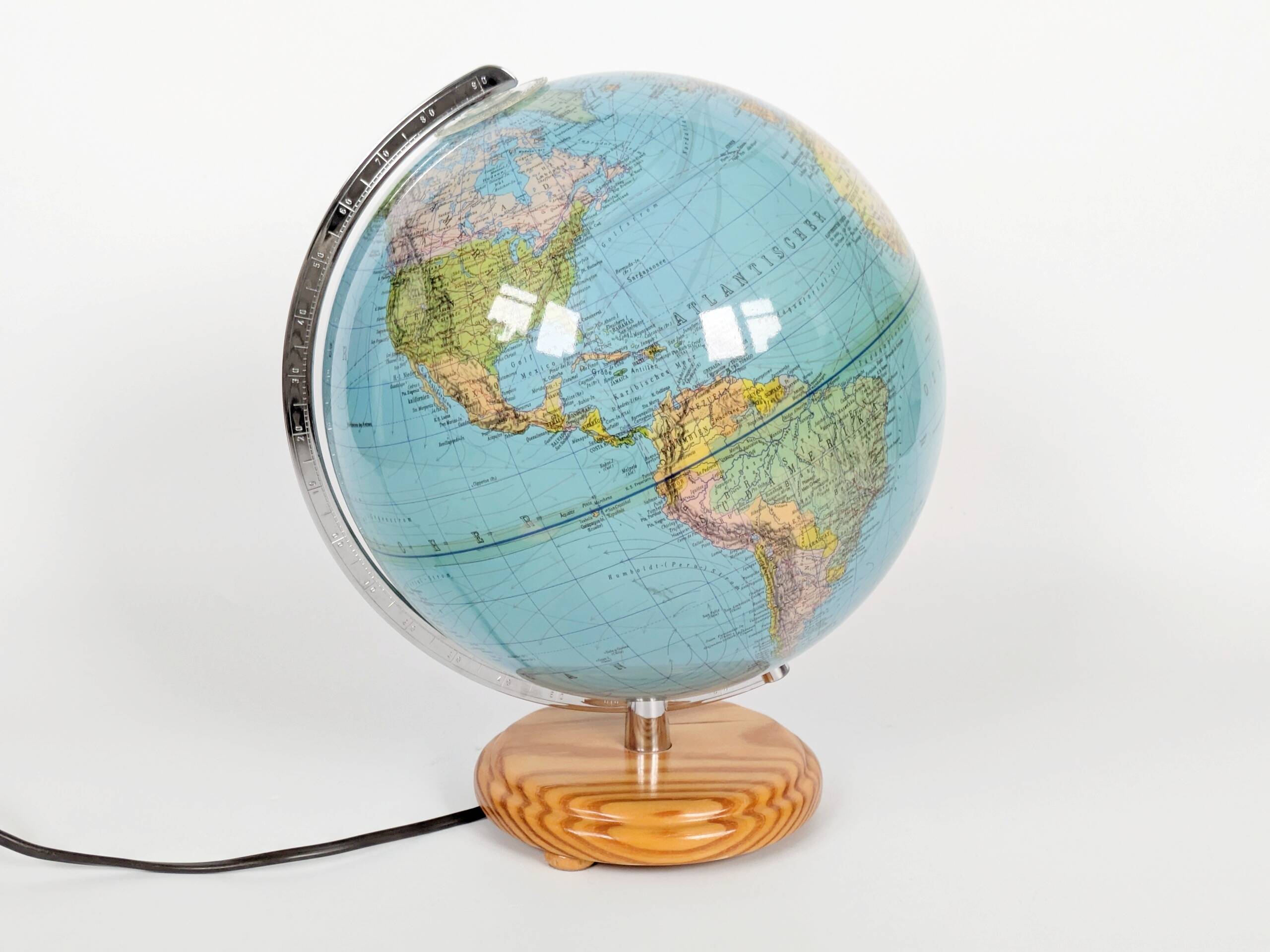 Columbus Duplex illuminated globe on a wooden base, 1980s