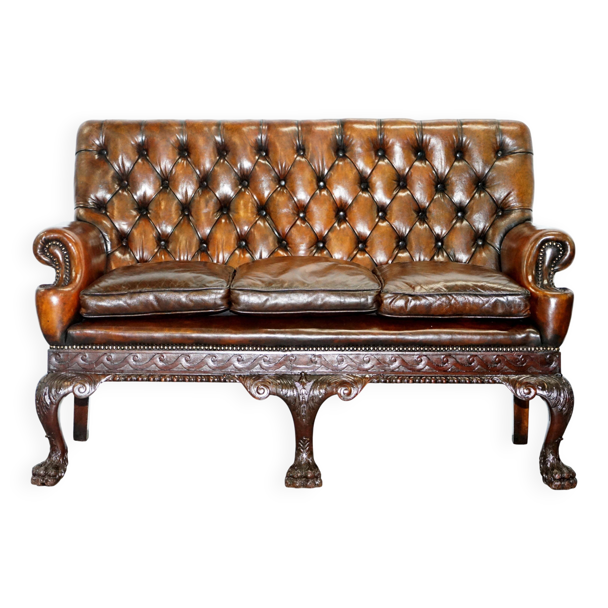 Chesterfield leather canapé in Georgian style with lion paw carved feet.
