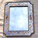 50s Eglomisé glass mirror with musical instrument decor