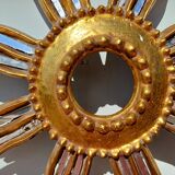 2 wooden sun mirrors and golden plaster