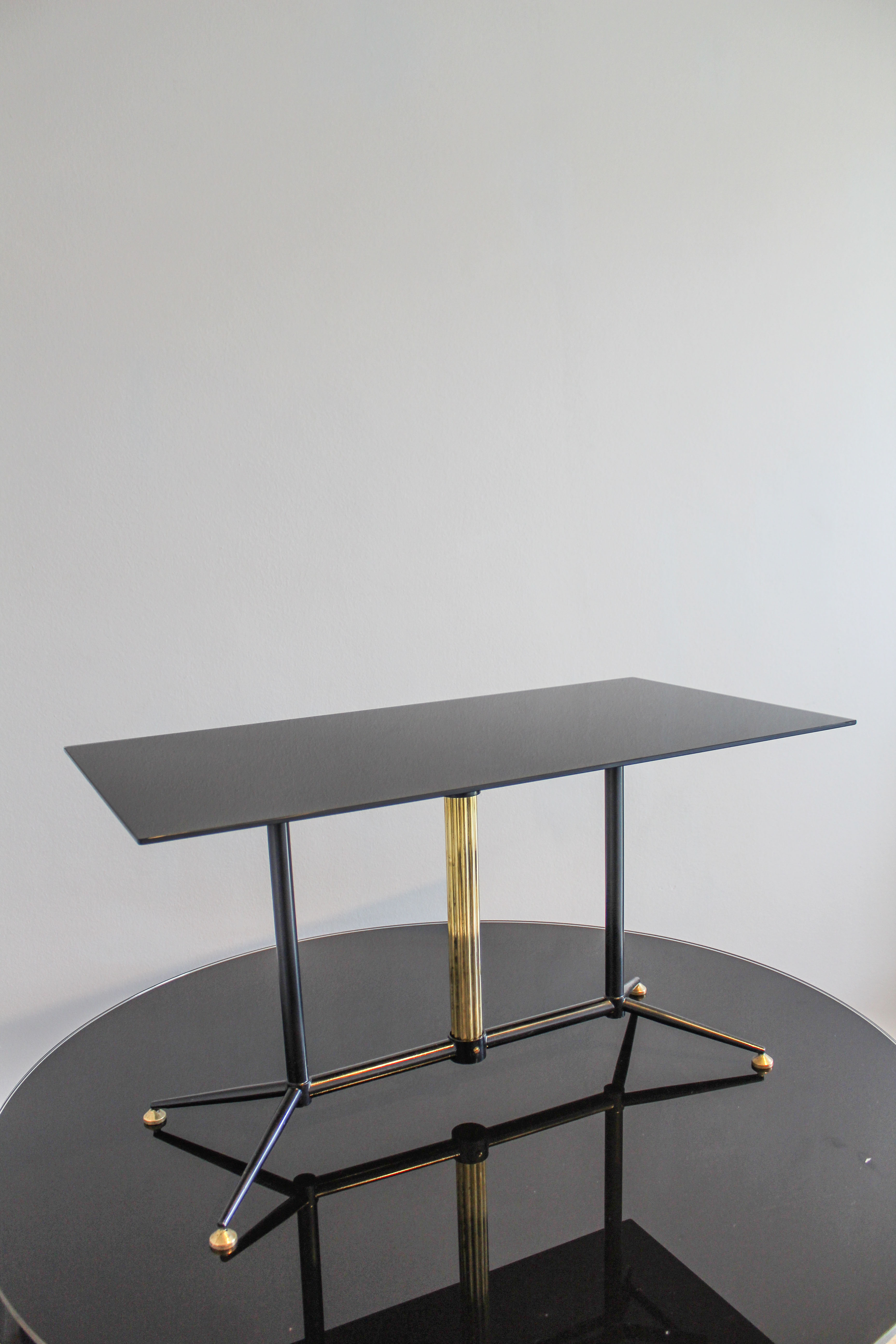 Coffee table in black glass lacquered brass and iron, Italy 50s