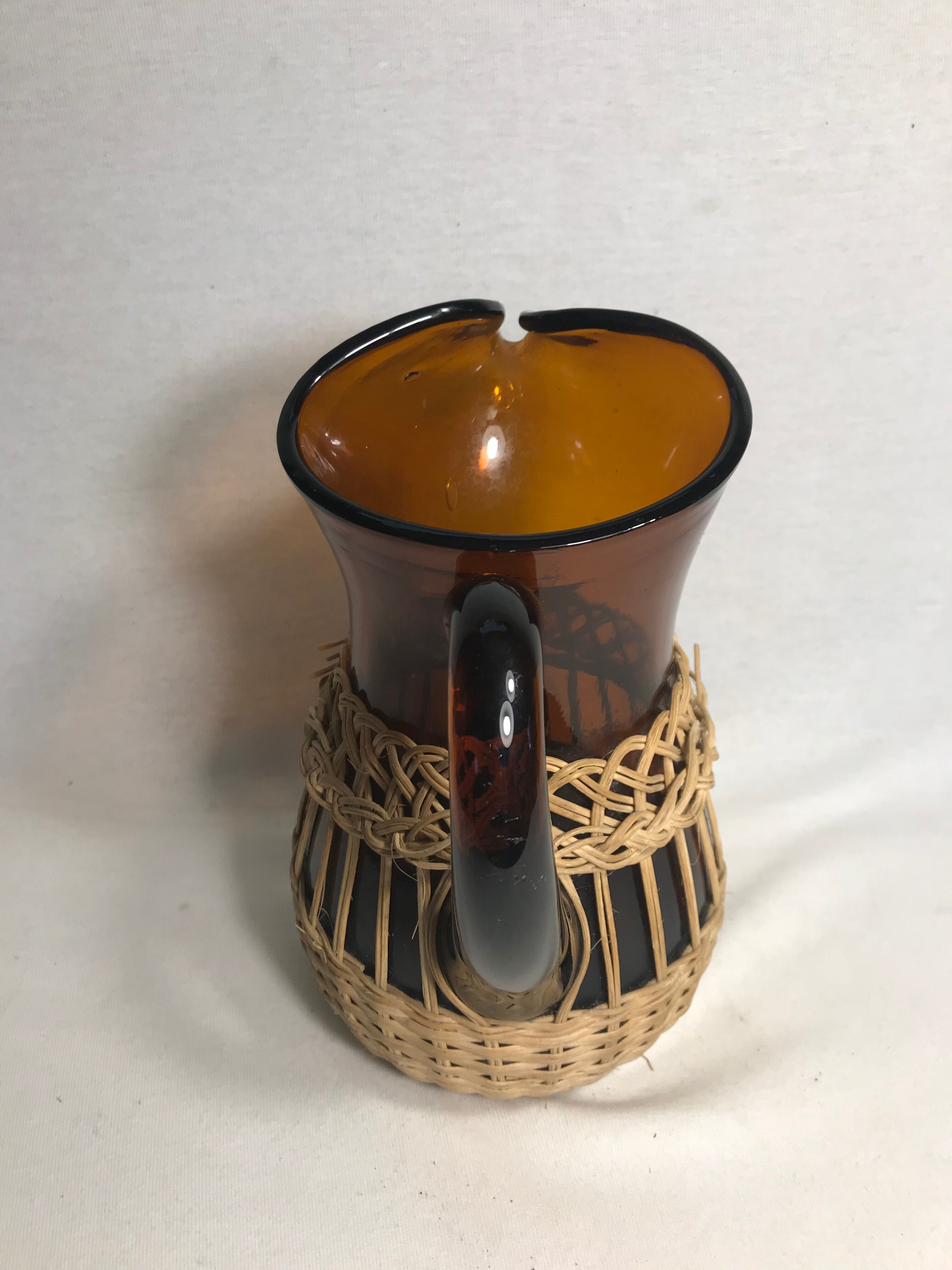 Service old juice carafe and its 9 orange glasses