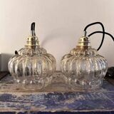 Set of two amber glass pendant lights