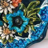 Decorative plate in relief with floral motif