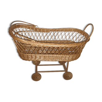 Vintage wicker cradle with wheels
