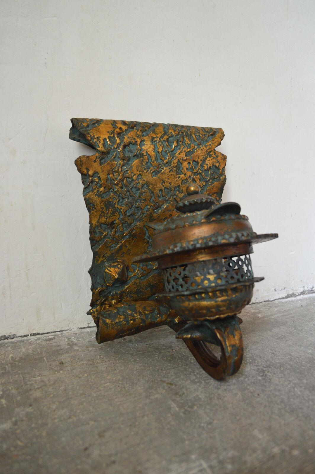 Pair of patinated wrought iron sconces