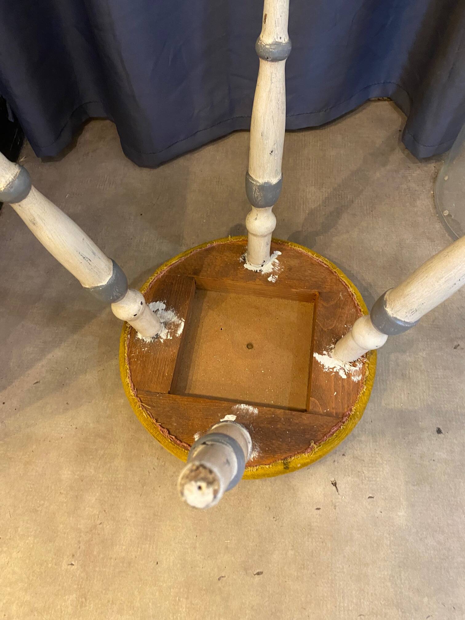 Old stool early 20th century wooden legs and round padded seat