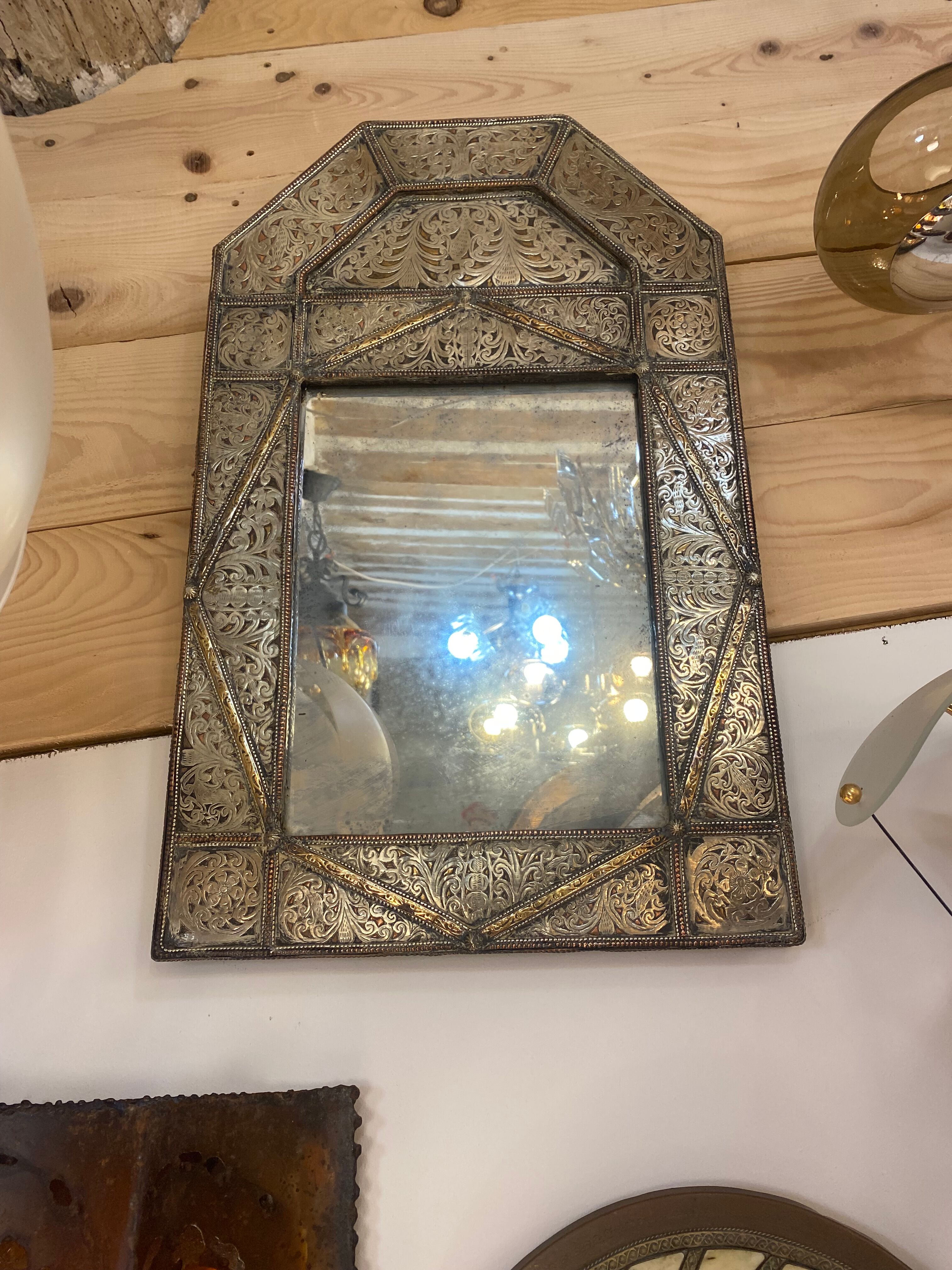 Mirror in silver metal and brass