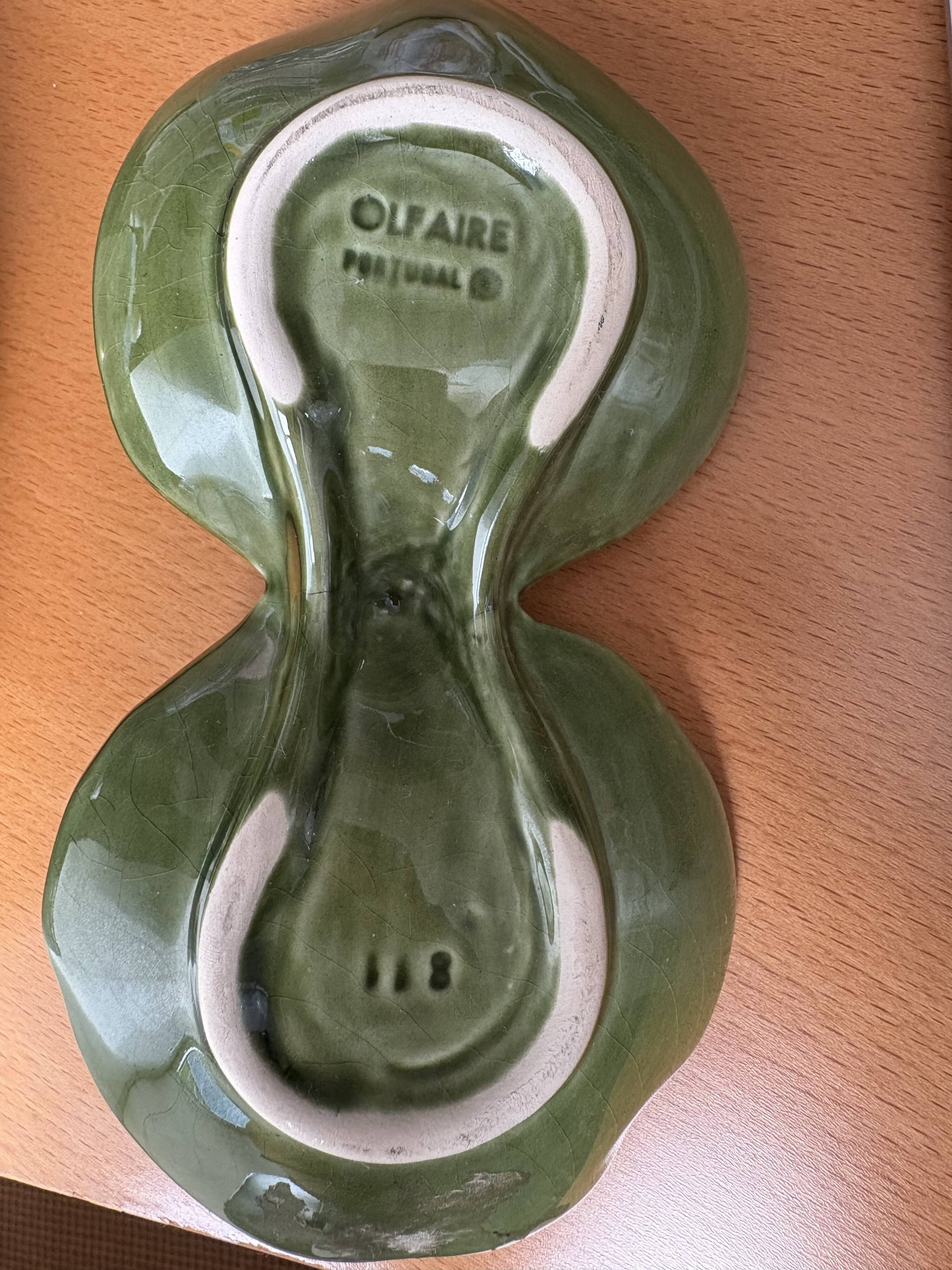 Salt and pepper shakers in the shape of a cabbage leaf.