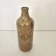 Pyrite stoneware single-flower vase in the shape of a bottle signed Aular?