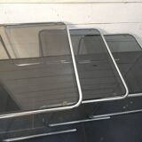 Nesting tables in chromed metal with smoked glass tops from the 1970s