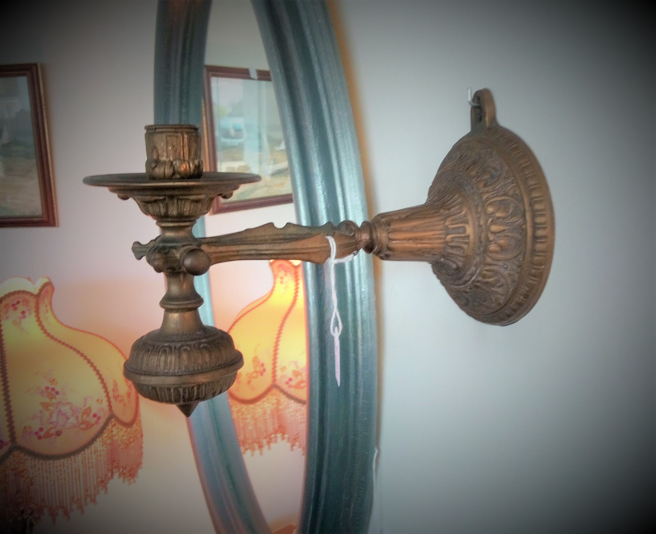 Articulated wall candle holder