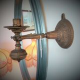 Articulated wall candle holder