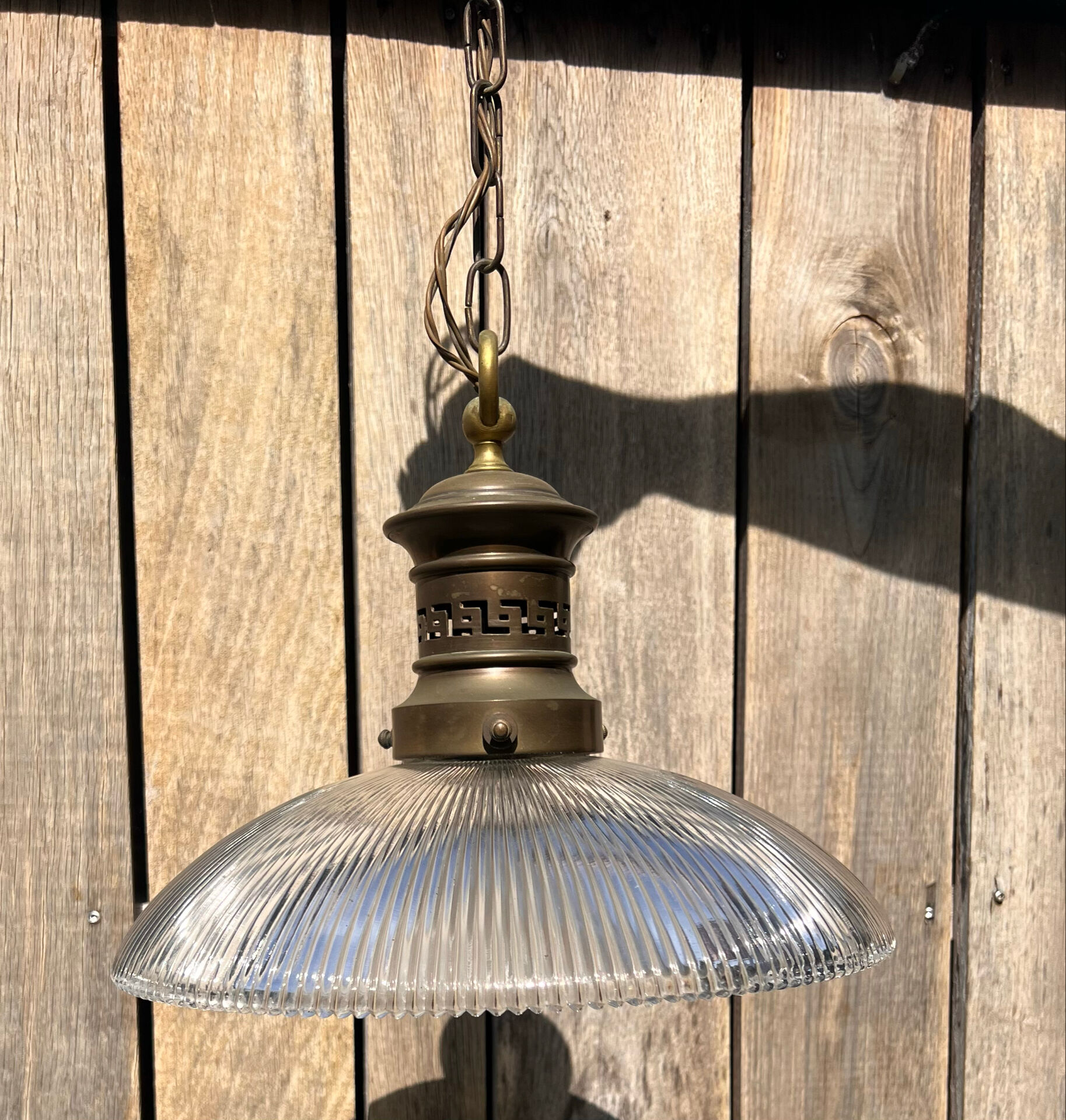 Art Deco suspension from the 1930s in glass and brass.