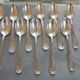 11 silver metal spoons