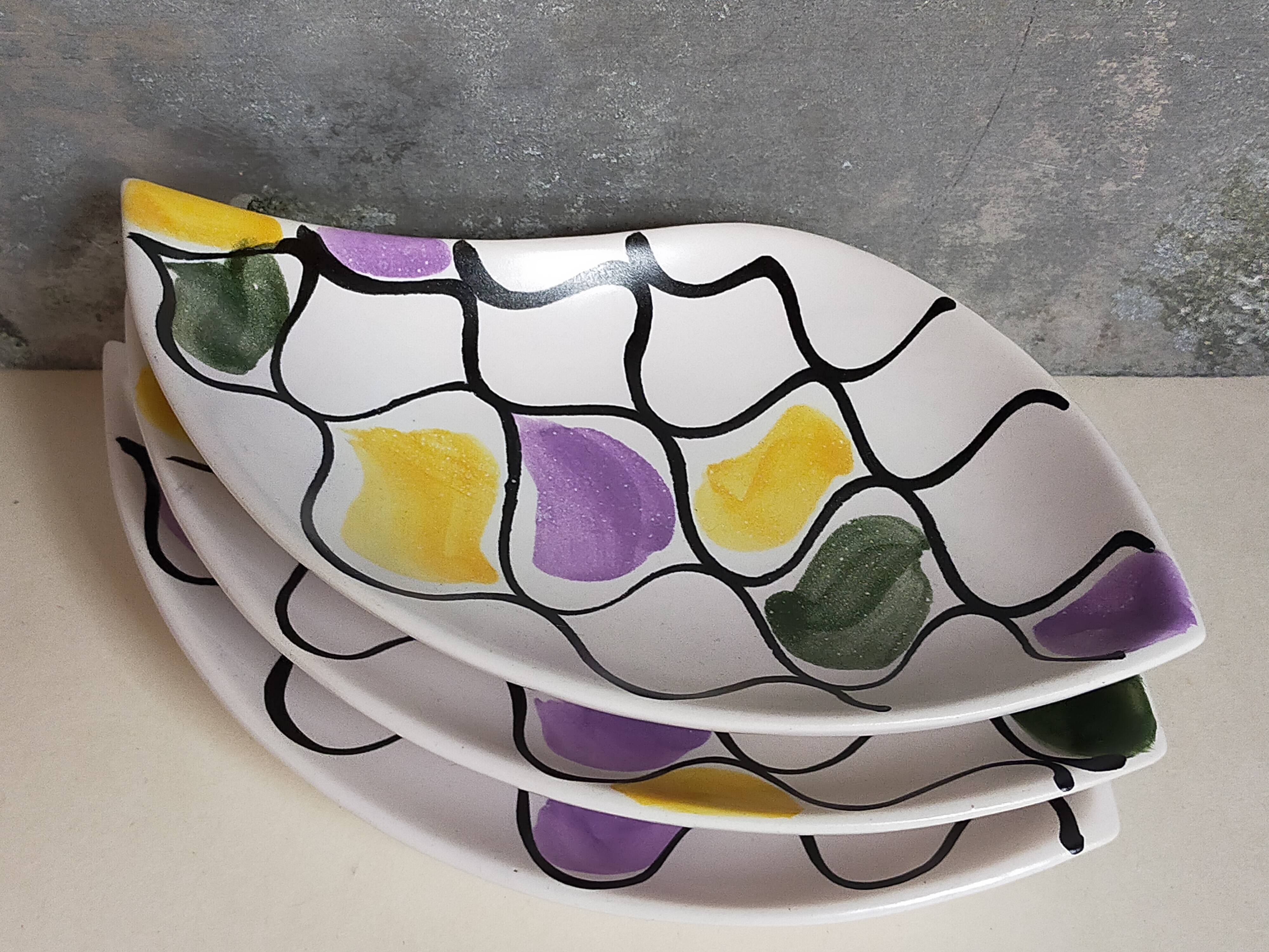 Three vintage free-form ceramic ravine dishes from the 1950s