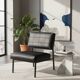 Modernist armchair in black faux leather and metal – 1960s