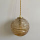 Baladeuse globe vintage en verre ambré 