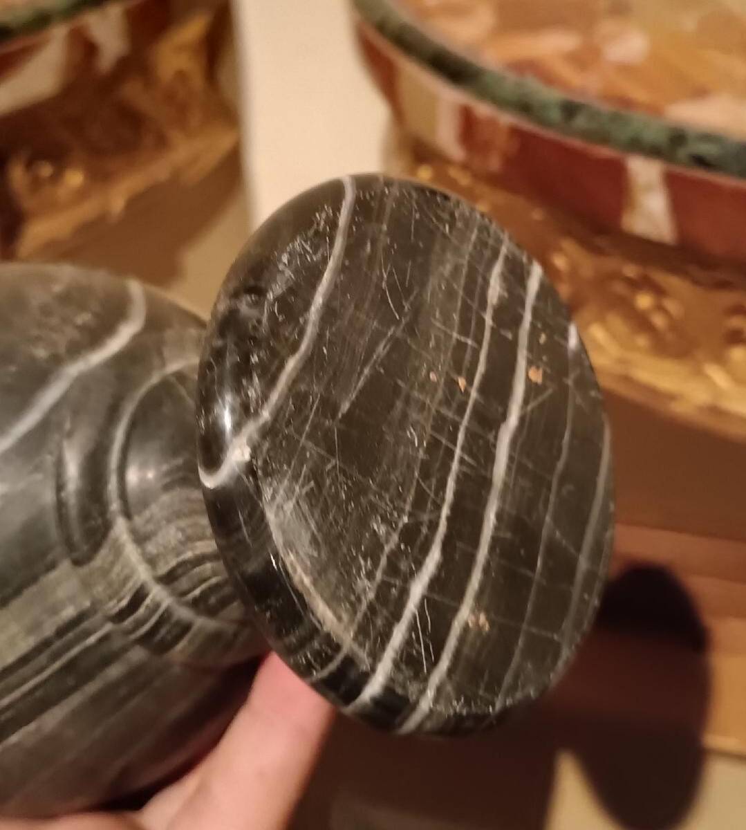 Pair of black serpentine marble vase-urns, early 20th century, Empire style