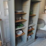 Vintage furniture transformed into a bookcase, verdigris patinated sideboard.