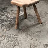 Old wooden tripod stool