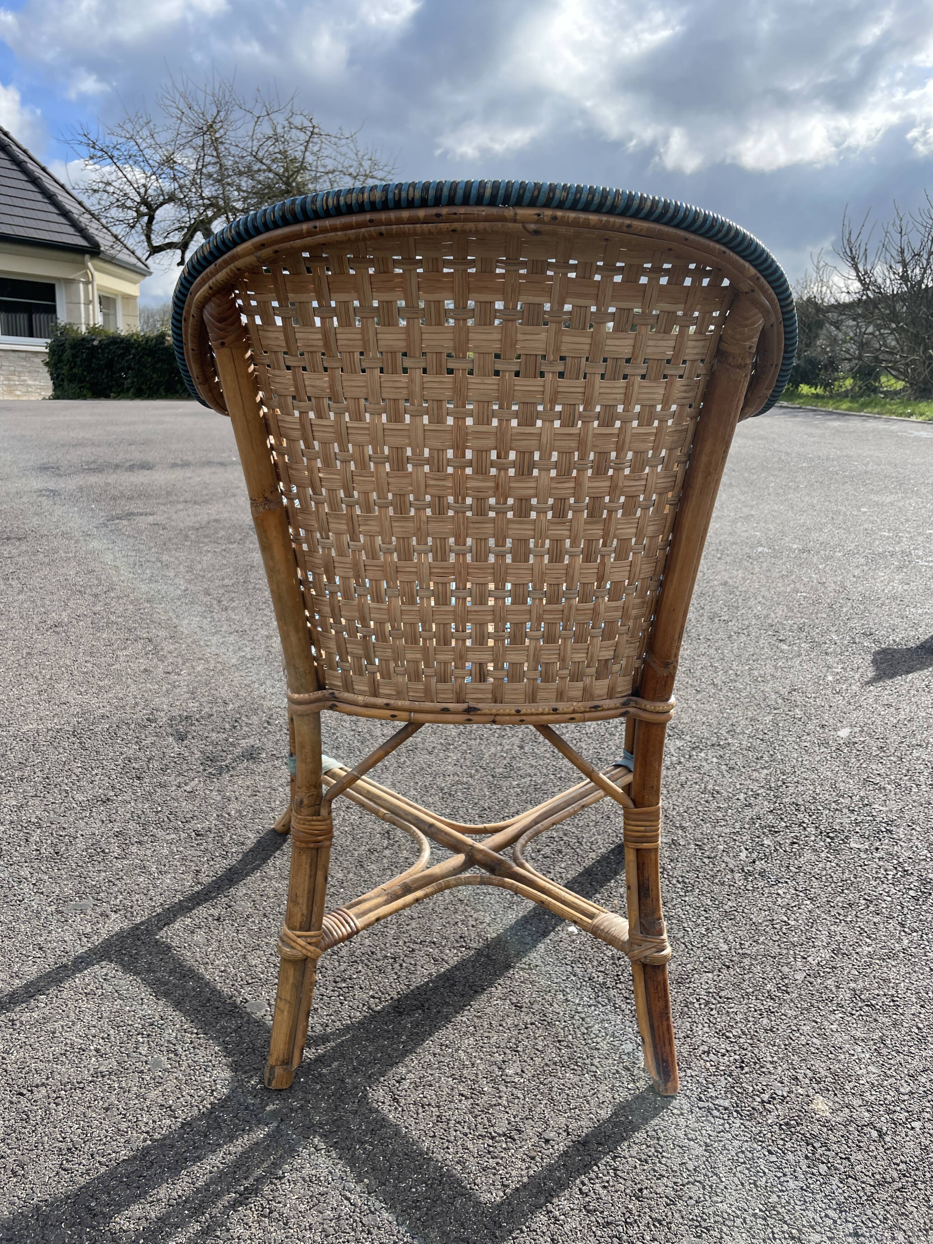 Old vintage woven and rattan wicker armchair 1930