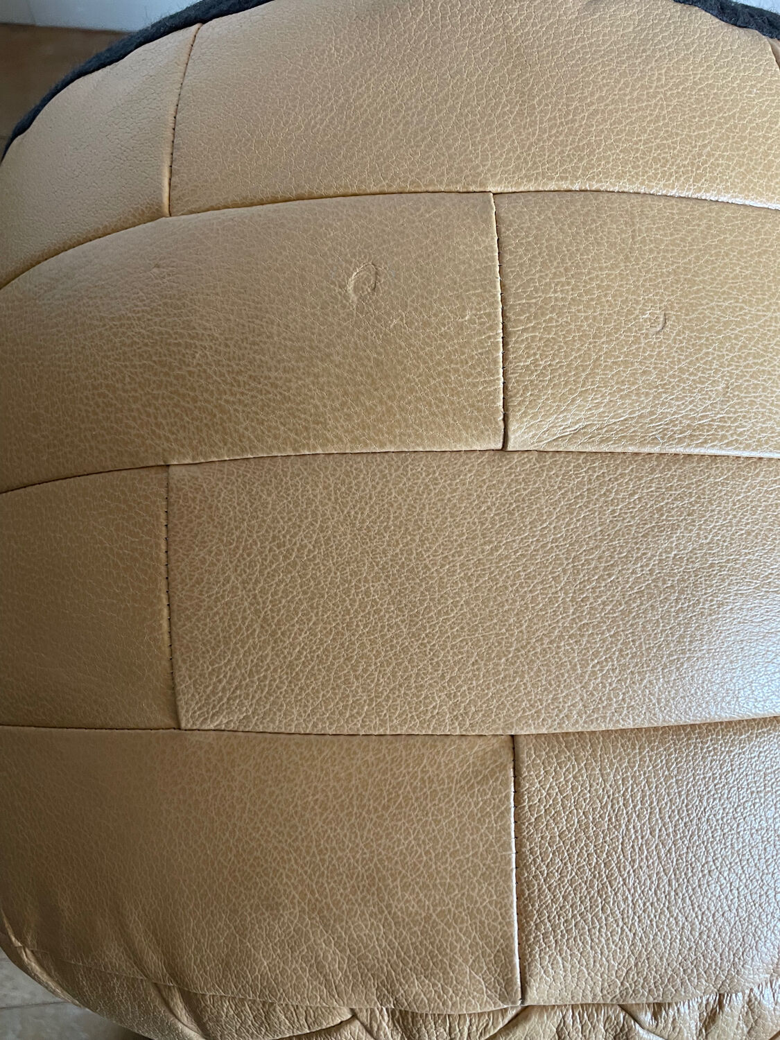 Beige patchwork leather pouf from Sède
