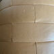 Beige patchwork leather pouf from Sède