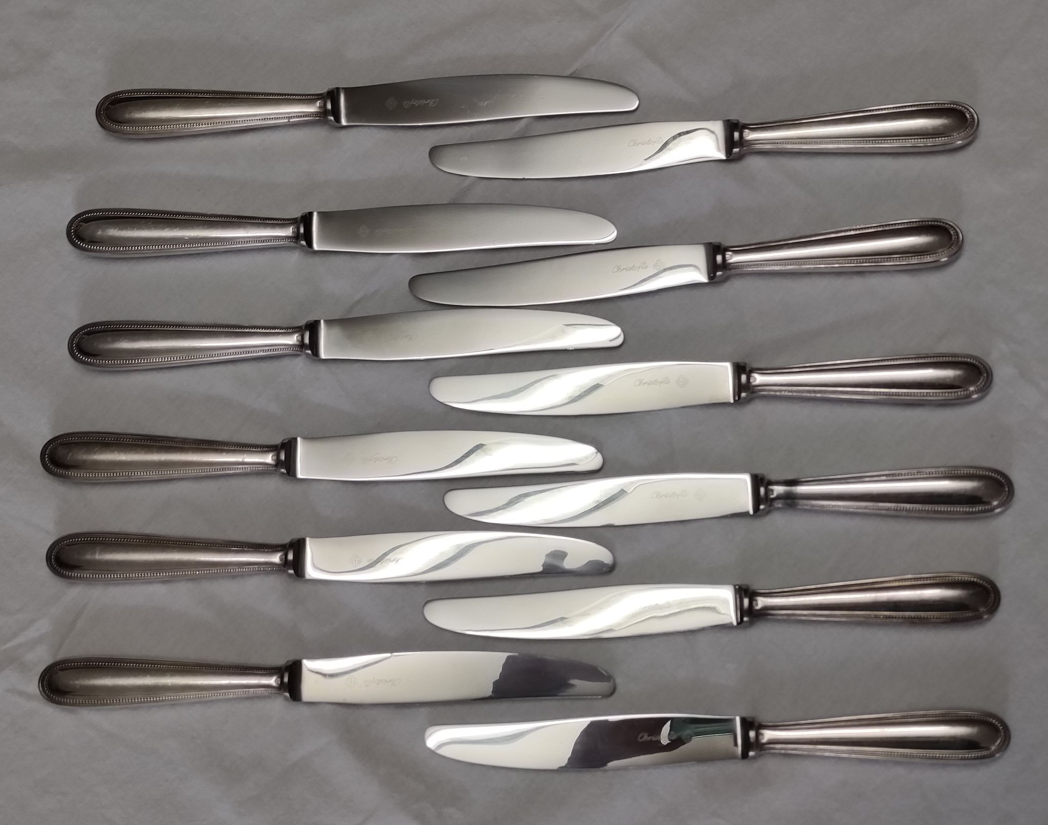 set of 12 Christofle table knives model "pearls" in silver metal from the 60s