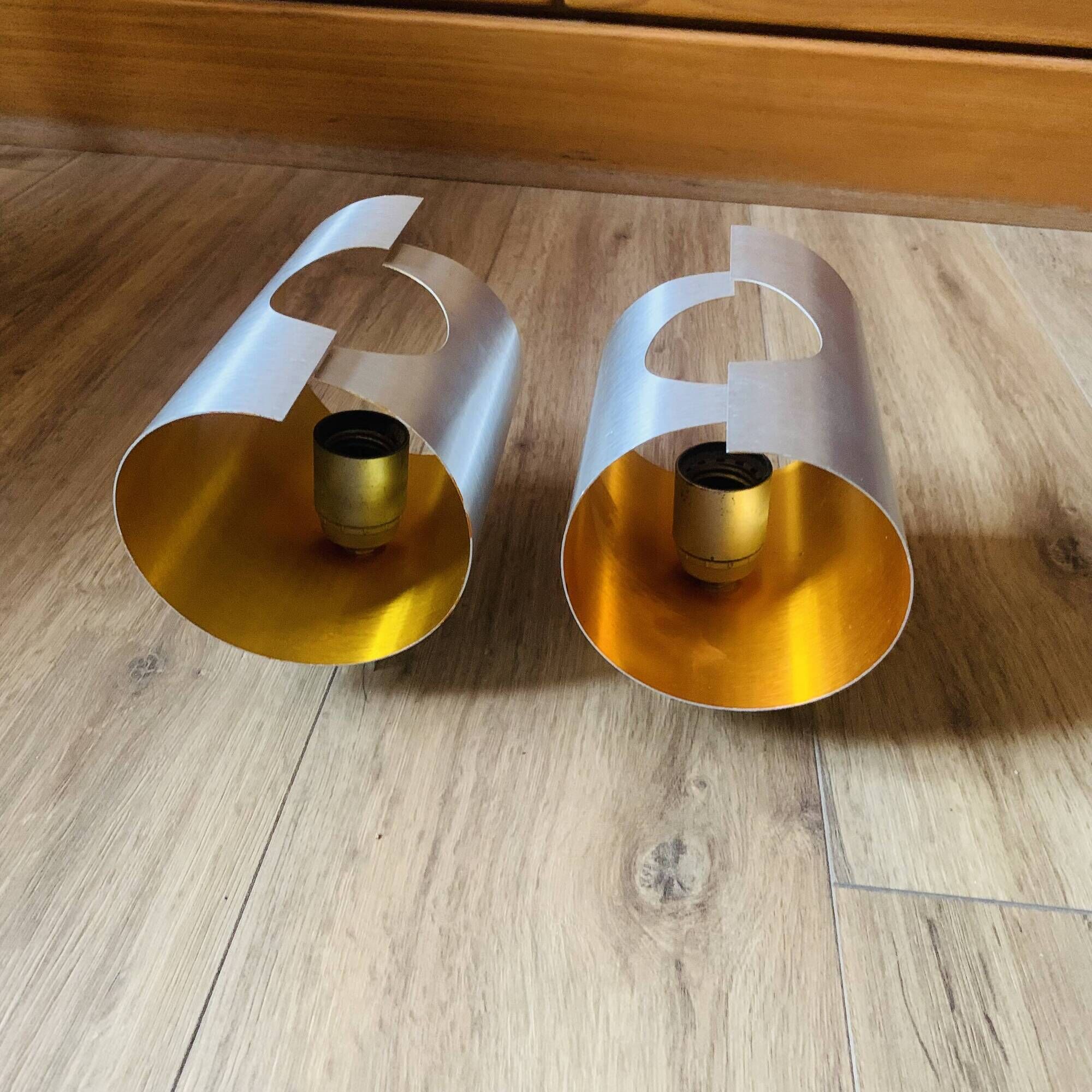 Pair of Space Age wall lights in brushed metal with a copper-orange interior.