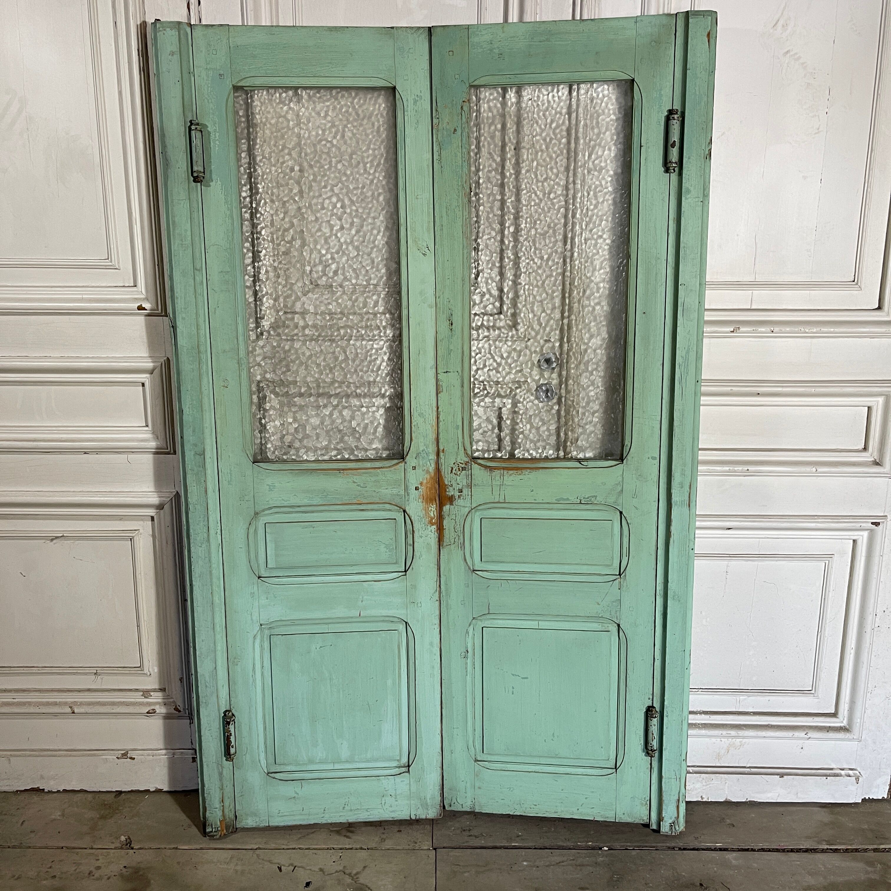 Old pair of saloon type glass doors