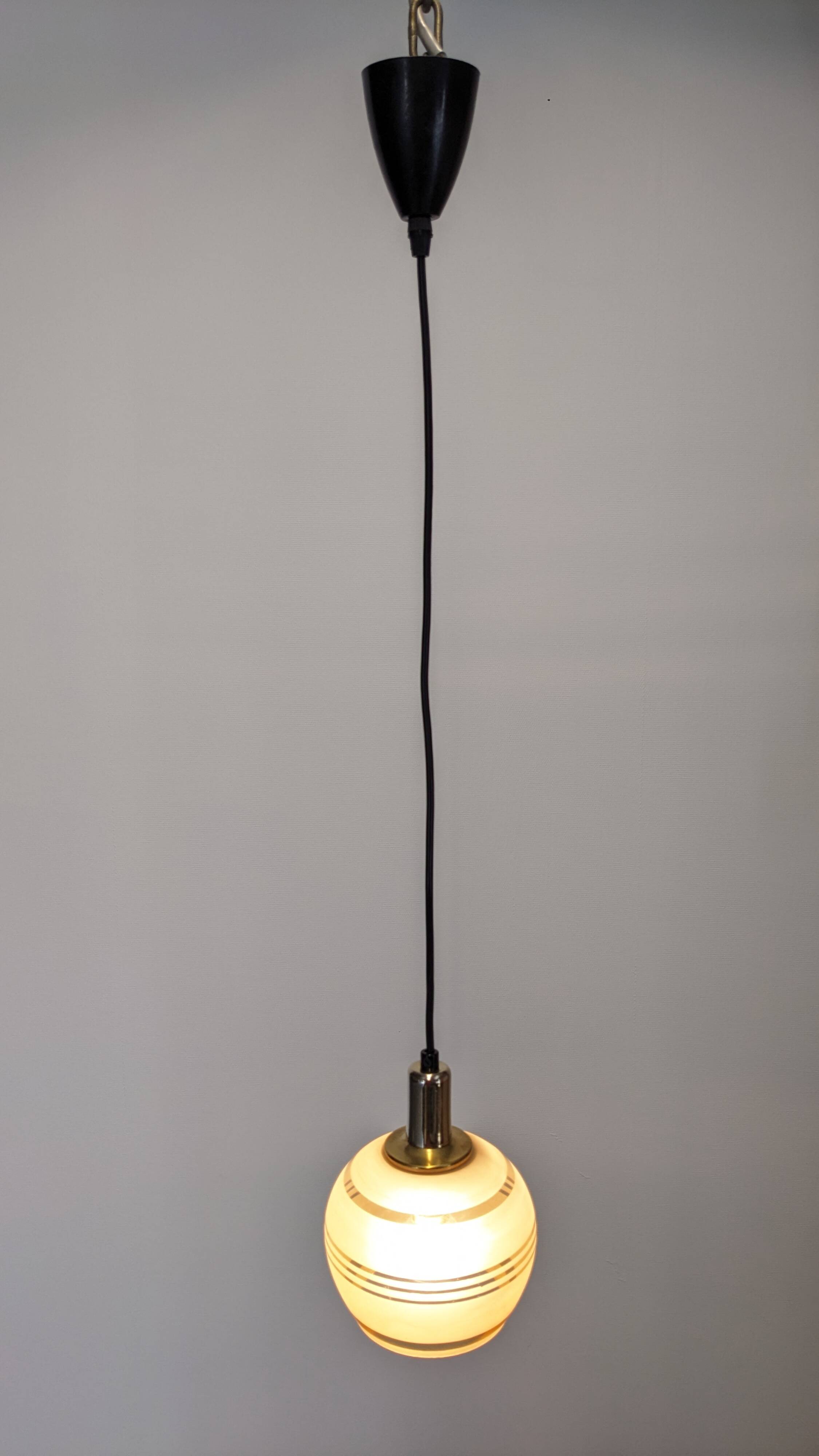 Art Deco style ball pendant light in gold glass