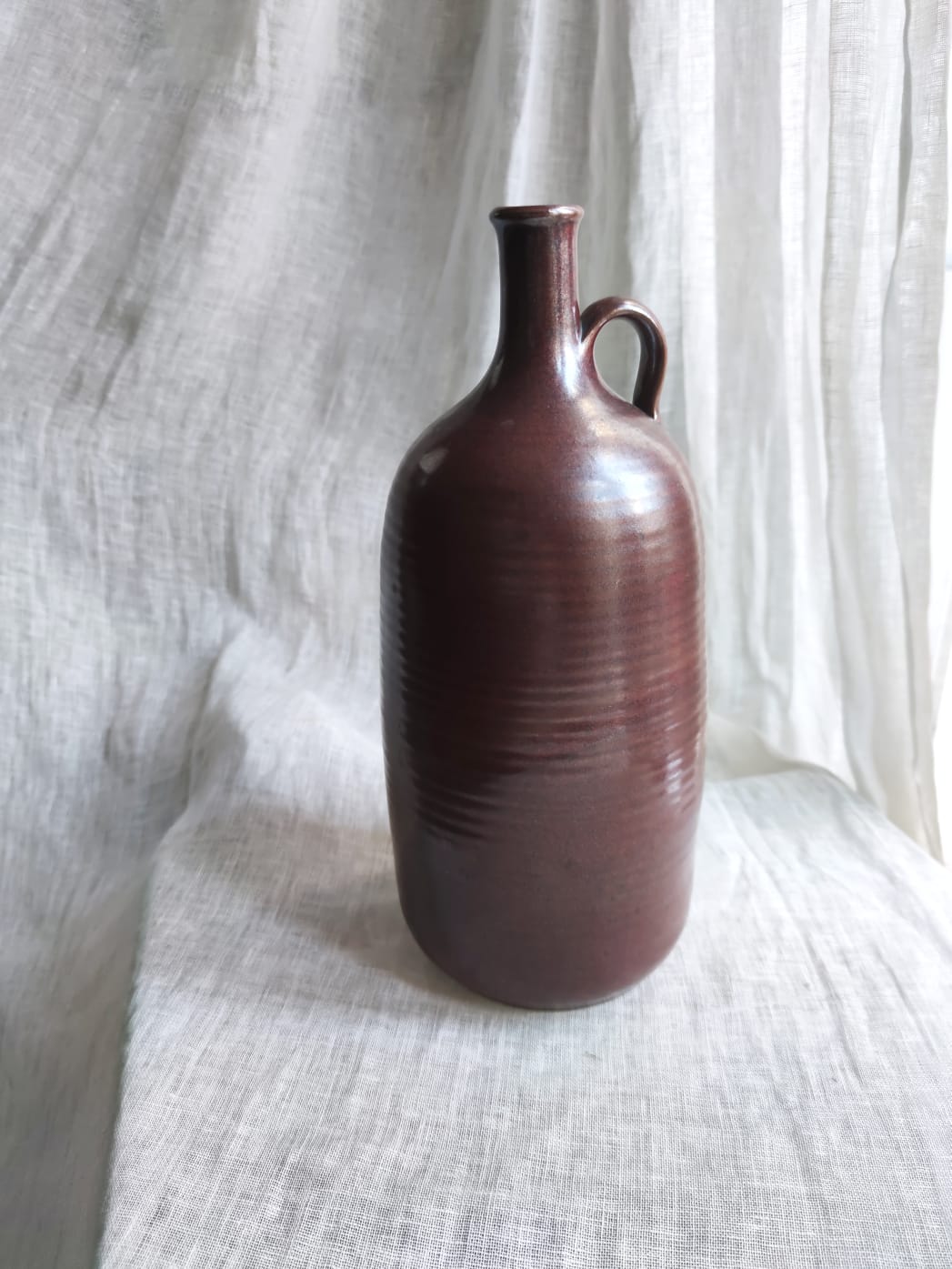 Large burgundy jar