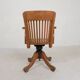 Oak office chair with adjustable spring system and height adjustment, 1950s.