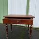 Wooden side table with turned legs