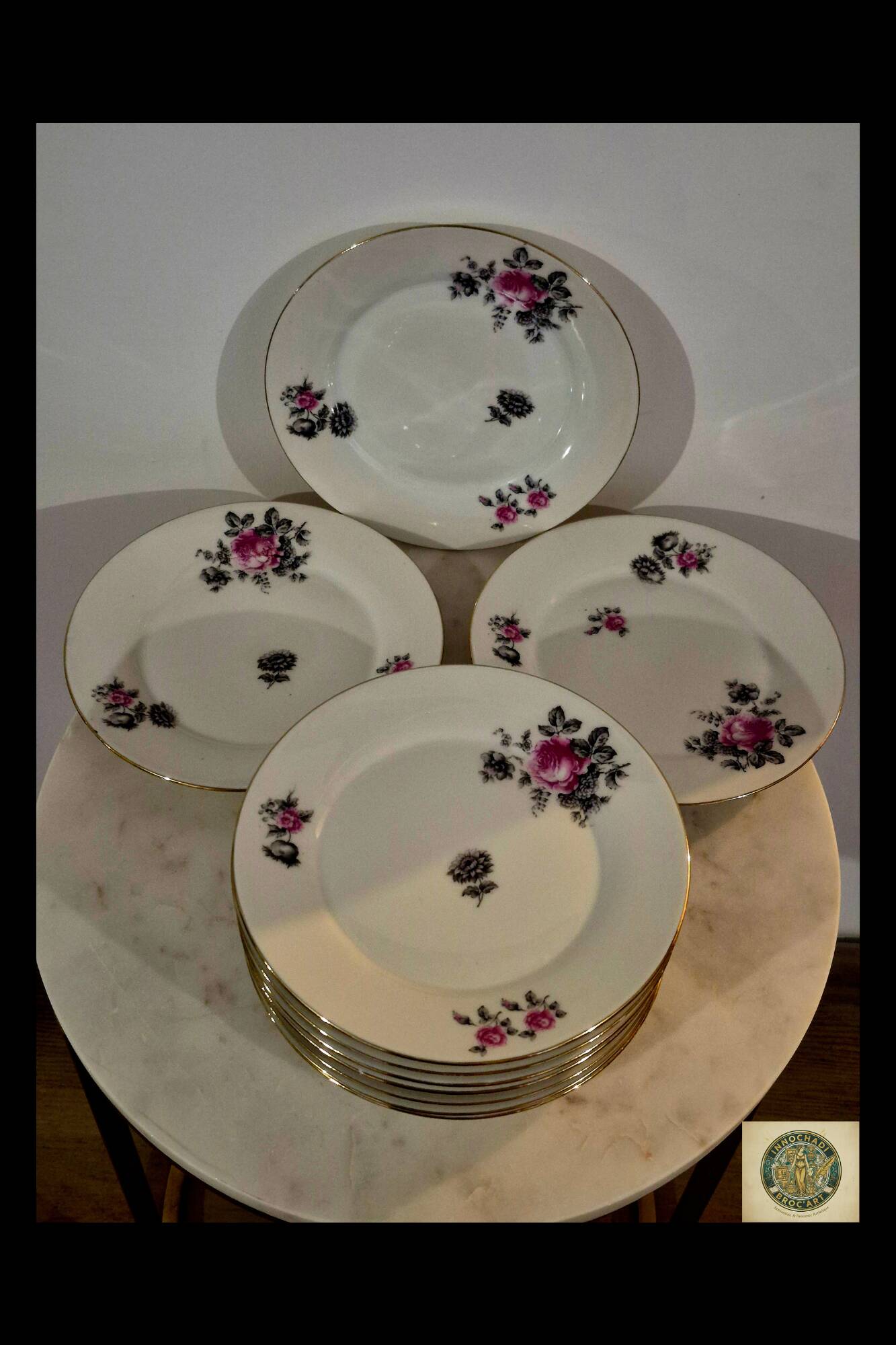 Service of 12 porcelain plates in romantic style.