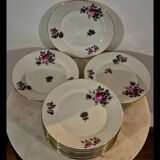 Service of 12 porcelain plates in romantic style.