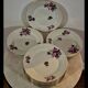 Service of 12 porcelain plates in romantic style.