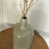 Old light grey ceramic bottle